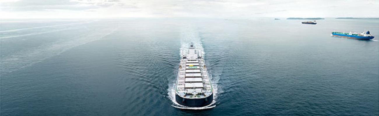 front_aerial_view_container_ship_in_water_fs_md_1300x400